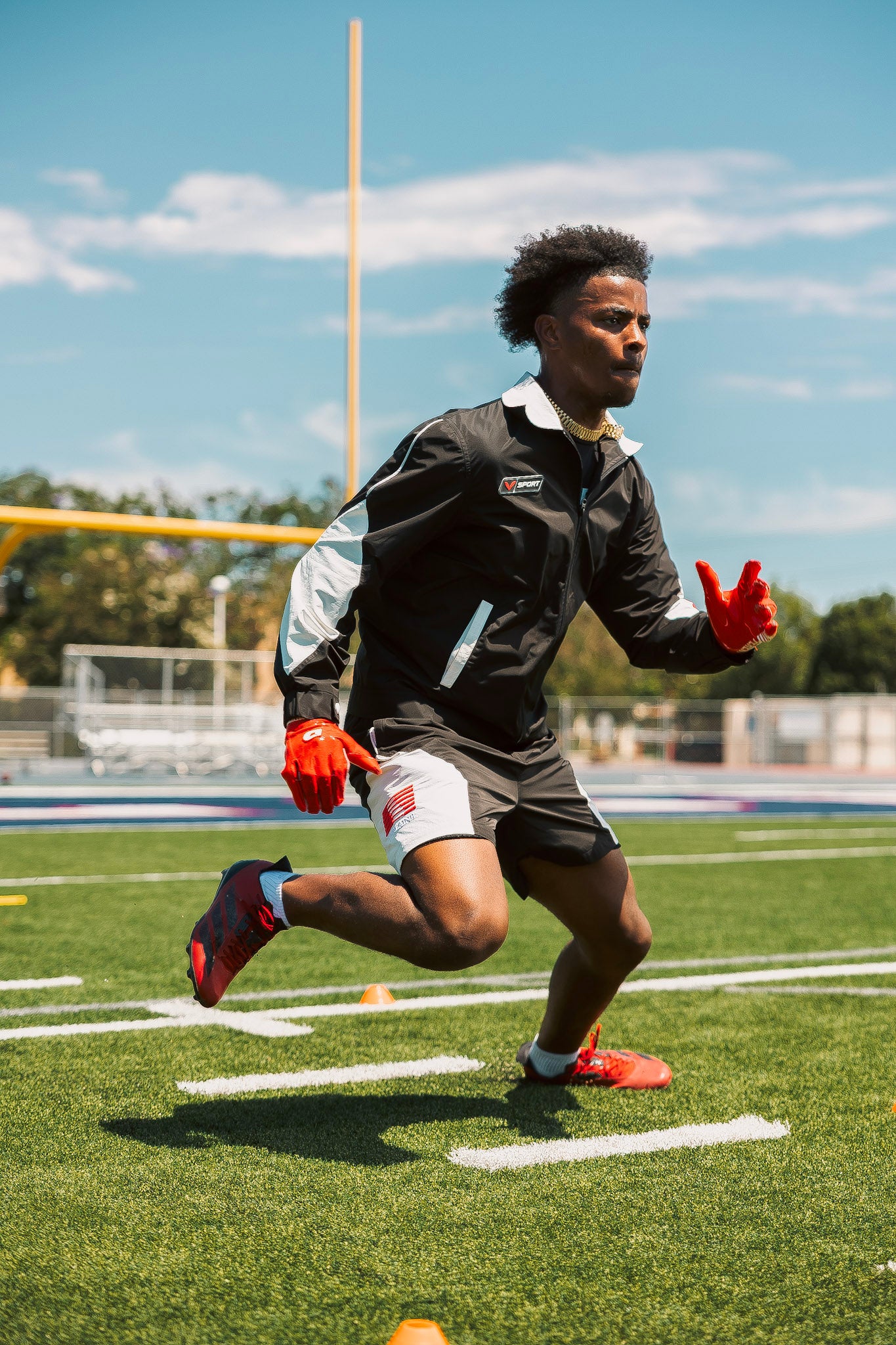 Athlete sprinting on a football field